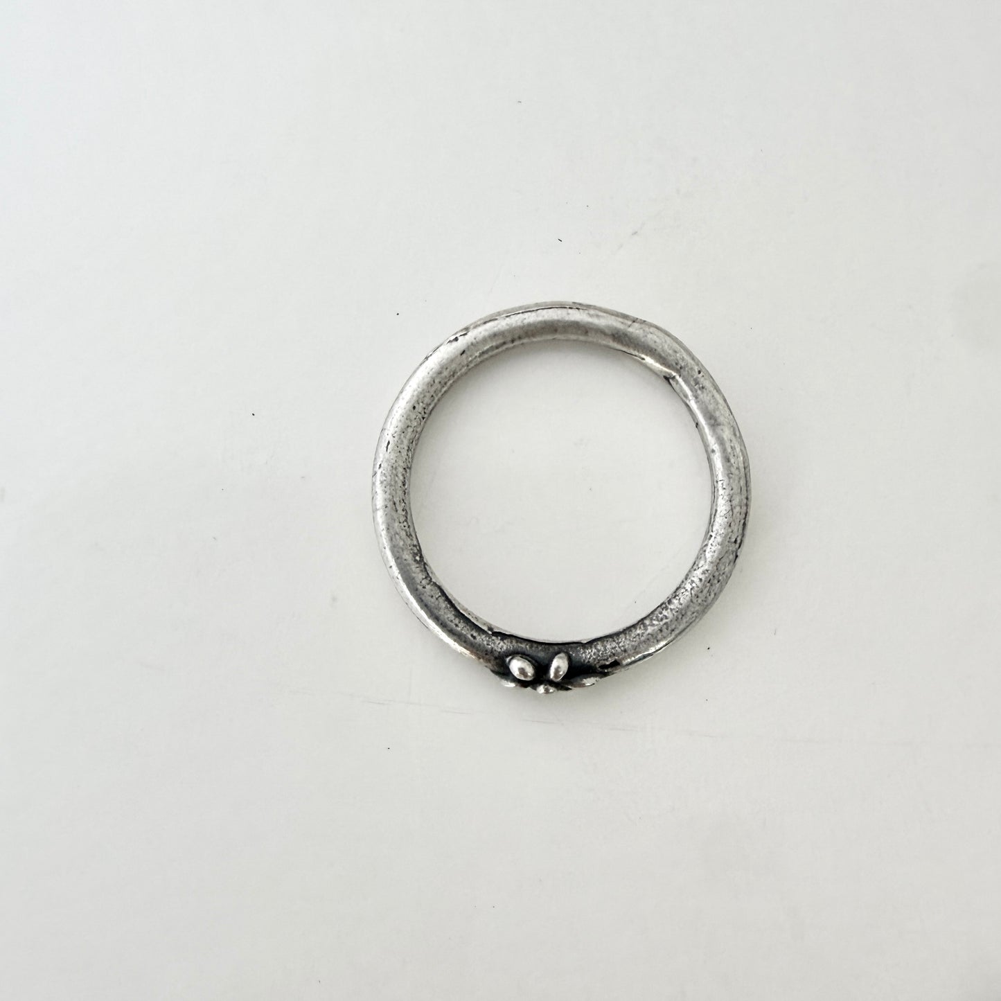 Simple sterling silver, round wire ring- Tiny Flower design
