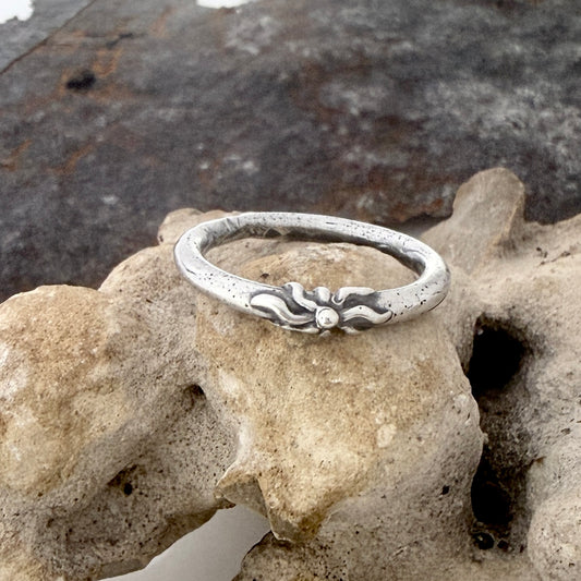 Sterling silver  round band ring with a sun image as a center design